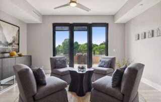 living room view with 4 chairs.